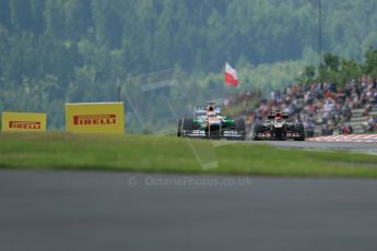 World © Octane Photographic Ltd. F1 German GP - Nurburgring. Saturday 6th July 2013 - Practice three. Sahara Force India VJM06 - Paul di Resta and Lotus F1 Team E21 - Kimi Raikkonen. Digital Ref : 0744lw1d6744