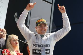 World © Octane Photographic Ltd. F1 British GP - Silverstone, Sunday 30th June 2013 - Race. Mercedes AMG Petronas F1 W04 - Nico Rosberg celebrates walking onto the podium. Digital Ref : 0734lw1d2773