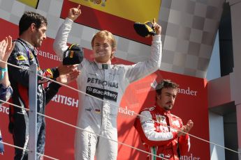 World © Octane Photographic Ltd. F1 British GP - Silverstone, Sunday 30th June 2013 - Race. Mercedes AMG Petronas F1 W04 - Nico Rosberg celebrates his win on the podium. Digital Ref : 0734lw1d2818