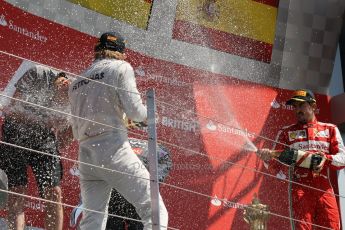 World © Octane Photographic Ltd. F1 British GP - Silverstone, Sunday 30th June 2013 - Race. Mercedes AMG Petronas F1 W04 - Nico Rosberg celebrates his win on the podium. Digital Ref : 0734lw1d2880