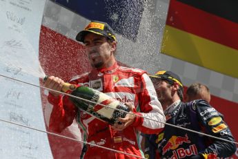 World © Octane Photographic Ltd. F1 British GP - Silverstone, Sunday 30th June 2013 - Race. Scuderia Ferrari F138 - Fernando Alonso sprays his champagne from the podium. Digital Ref : 0734lw1d2908