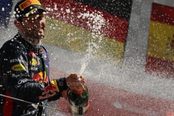 World © Octane Photographic Ltd. F1 British GP - Silverstone, Sunday 30th June 2013 - Race. Infiniti Red Bull Racing RB9 - Mark Webber sprays his champagne from the podium. Digital Ref : 0734lw1d2926