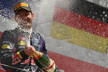 World © Octane Photographic Ltd. F1 British GP - Silverstone, Sunday 30th June 2013 - Race. Infiniti Red Bull Racing RB9 - Mark Webber sprays his champagne from the podium. Digital Ref : 0734lw1d2928