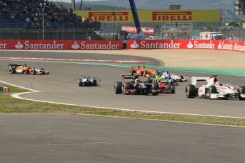 World © Octane Photographic Ltd. GP2 German GP, Nurburgring, Sunday 7th July 2013. Race 2. The pack avoids the spinning Nathanaël Berthon - Trident Racing. Digital Ref : 0747lw1d4802