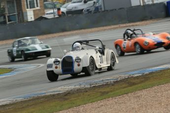 World © Octane Photographic Ltd. Donington Park 80th Anniversary Meeting (March 1933 – March 2013). HSCC Historic Road Sports Championship supported by Witchampton Garage (Inc. Class B2 Guards Trophy). Tim Pearce's Morgan Plus 8 take Redgate as Justin Murphy's Ginetta G4 misses its braking point. Digital Ref : 0594lw1d6963