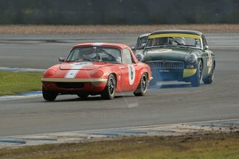 World © Octane Photographic Ltd. Donington Park 80th Anniversary Meeting (March 1933 – March 2013). HSCC Historic Road Sports Championship supported by Witchampton Garage (Inc. Class B2 Guards Trophy). Larry Kennedy's smoking Lotus Elan S4 and Peter Boyes/Jan Boyes – MGB. Digital Ref : 0594lw1d7030