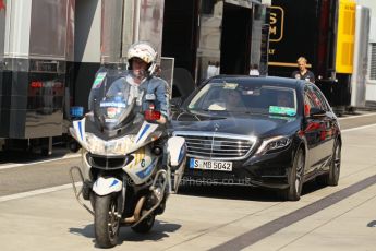 World © Octane Photographic Ltd. F1 Hungarian GP - Hungaroring, Saturday 27th July 2013 - Paddock. Bernie Ecclestone arrives with police escort. Digital Ref : 0762lw1d0715