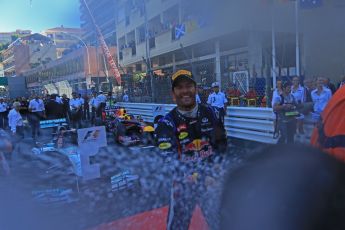 World © Octane Photographic Ltd. F1 Monaco GP, Monte Carlo - Sunday 26th May - Podium and celebrations. Infiniti Red Bull Racing's Mark Webber sprays the team and the media with champagne. Digital Ref : 0712lw1d2066