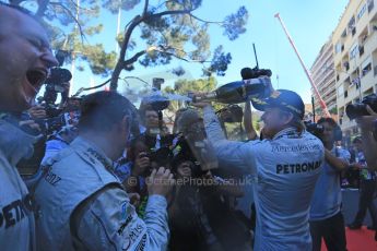 World © Octane Photographic Ltd. F1 Monaco GP, Monte Carlo - Sunday 26th May - Podium and celebrations. Mercedes AMG Petronas' Nico Rosberg sprays the team and the media with champagne after his lights to flag victory. Digital Ref : 0712lw1d2076
