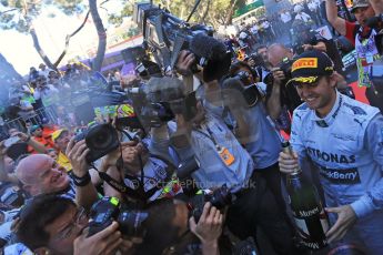 World © Octane Photographic Ltd. F1 Monaco GP, Monte Carlo - Sunday 26th May - Podium and celebrations. Mercedes AMG Petronas' Nico Rosberg sprays the team and the media with champagne after his lights to flag victory. Digital Ref : 0712lw1d2098