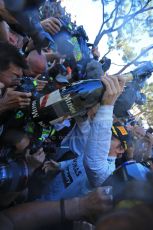 World © Octane Photographic Ltd. F1 Monaco GP, Monte Carlo - Sunday 26th May - Podium and celebrations. Mercedes AMG Petronas' Nico Rosberg sprays the team and the media with champagne after his lights to flag victory. Digital Ref : 0712lw1d2129