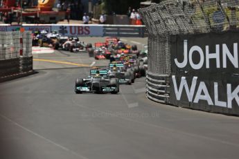 World © Octane Photographic Ltd. F1 Monaco GP, Monte Carlo - Sunday 26th May - Race. The Mercedes AMG Petronas F1 W04 of Nico Rosberg leads Lewis Hamilton and the Infiniti Red Bull Racing RB9 of Sebastian Vettel up the hill after Ste.Devote on the 1st lap. Digital Ref : 0711lw1d0861