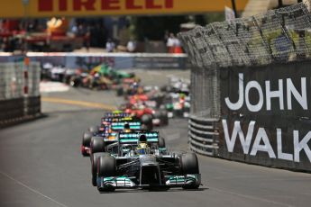 World © Octane Photographic Ltd. F1 Monaco GP, Monte Carlo - Sunday 26th May - Race. The Mercedes AMG Petronas F1 W04 of Nico Rosberg leads Lewis Hamilton and the Infiniti Red Bull Racing RB9 of Sebastian Vettel up the hill after Ste.Devote on the 1st lap. Digital Ref : 0711lw1d0872