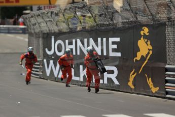 World © Octane Photographic Ltd. F1 Monaco GP, Monte Carlo - Sunday 26th May - Race. The race marshals clear the Williams wing and debris from the track before the cars come around for lap 2. Digital Ref : 0711lw1d0965