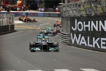 World © Octane Photographic Ltd. F1 Monaco GP, Monte Carlo - Sunday 26th May - Race. The Mercedes AMG Petronas F1 W04 of Nico Rosberg extends his lead over Lewis Hamilton and the Infiniti Red Bull Racing RB9 of Sebastian Vettel up the hill after Ste.Devote on the 2nd lap. Digital Ref : 0711lw1d0978