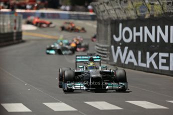 World © Octane Photographic Ltd. F1 Monaco GP, Monte Carlo - Sunday 26th May - Race. The Mercedes AMG Petronas F1 W04 of Nico Rosberg extends his lead over Lewis Hamilton and the Infiniti Red Bull Racing RB9 of Sebastian Vettel up the hill after Ste.Devote on the 2nd lap. Digital Ref : 0711lw1d0982