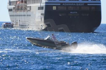 World © Octane Photographic Ltd. A 7.1m Buster Super Magnum (the new improved 2013 model) powers past the Azamara Quest. Digital Ref : 07137d2955