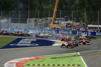 World © Octane Photographic Ltd. F1 Italian GP - Monza, Sunday 8th September 2013 - Race. Infiniti Red Bull Racing RB9 - Sebastian Vettel leads the pack into turn 1. Digital Ref : 0824lw1d6089