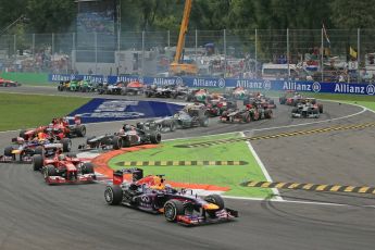World © Octane Photographic Ltd. F1 Italian GP - Monza, Sunday 8th September 2013 - Race. Infiniti Red Bull Racing RB9 - Sebastian Vettel leads the pack into turn 1. Digital Ref : 0824lw1d6106