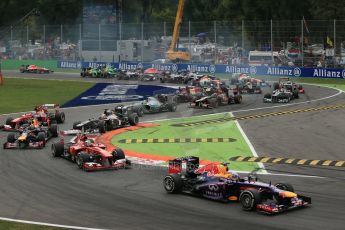 World © Octane Photographic Ltd. F1 Italian GP - Monza, Sunday 8th September 2013 - Race. Infiniti Red Bull Racing RB9 - Sebastian Vettel leads the pack into turn 1. Digital Ref : 0824lw1d6108