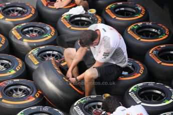 World © Octane Photographic Ltd. F1 Italian GP - Monza, Thursday 5th September 2013 - Paddock. McLaren mechanics work on weekends tires. Digital Ref : Digital Ref : 0808lw1d2054