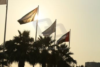 World © Octane Photographic Ltd. Friday 21st November 2014. Abu Dhabi Grand Prix - Yas Marina Circuit - Formula 1 Practice 2. F1 flags flying at sunset. Digital Ref: 1161CB1D6578