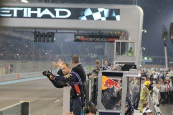 World © Octane Photographic Ltd. Sunday 23rd November 2014. Abu Dhabi Grand Prix - Yas Marina Circuit - Formula 1 Podium. Infiniti Red Bull Racing welcome their team across the line. Digital Ref: 1173CB1D0141