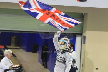 World © Octane Photographic Ltd. Sunday 23rd November 2014. Abu Dhabi Grand Prix - Yas Marina Circuit - Formula 1 Podium. Mercedes AMG Petronas – Lewis Hamilton - Race winner and 2014 World Champion. Digital Ref: 1173CB1D0426