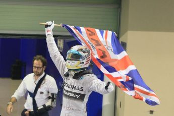 World © Octane Photographic Ltd. Sunday 23rd November 2014. Abu Dhabi Grand Prix - Yas Marina Circuit - Formula 1 Podium. Mercedes AMG Petronas – Lewis Hamilton - Race winner and 2014 World Champion. Digital Ref: 1173CB1D0435