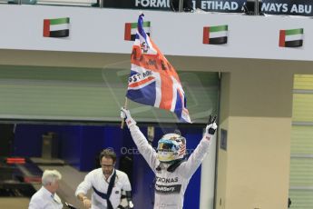 World © Octane Photographic Ltd. Sunday 23rd November 2014. Abu Dhabi Grand Prix - Yas Marina Circuit - Formula 1 Podium. Mercedes AMG Petronas – Lewis Hamilton - Race winner and 2014 World Champion. Digital Ref: 1173CB1D0439
