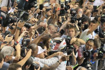 World © Octane Photographic Ltd. Sunday 23rd November 2014. Abu Dhabi Grand Prix - Yas Marina Circuit - Formula 1 Podium. Mercedes AMG Petronas – Lewis Hamilton - Race winner and 2014 World Champion greeting his team and family. Digital Ref: 1173CB1D0464