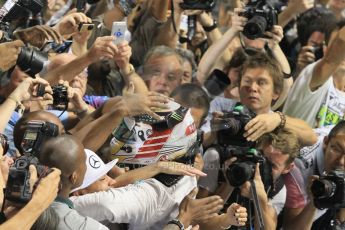 World © Octane Photographic Ltd. Sunday 23rd November 2014. Abu Dhabi Grand Prix - Yas Marina Circuit - Formula 1 Podium. Mercedes AMG Petronas – Lewis Hamilton - Race winner and 2014 World Champion greeting his team and family. Digital Ref: 1173CB1D0466