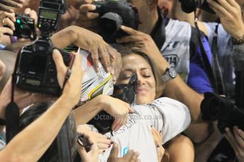 World © Octane Photographic Ltd. Sunday 23rd November 2014. Abu Dhabi Grand Prix - Yas Marina Circuit - Formula 1 Podium. Mercedes AMG Petronas – Lewis Hamilton - Race winner and 2014 World Champion and Nicole Scherzinger. Digital Ref: 1173CB1D0478