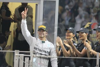 World © Octane Photographic Ltd. Sunday 23rd November 2014. Abu Dhabi Grand Prix - Yas Marina Circuit - Formula 1 Podium. Mercedes AMG Petronas – Lewis Hamilton - Race winner and 2014 World Champion. Digital Ref: 1173CB1D0715