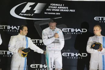 World © Octane Photographic Ltd. Sunday 23rd November 2014. Abu Dhabi Grand Prix - Yas Marina Circuit - Formula 1 Podium. Mercedes AMG Petronas – Lewis Hamilton - Race winner and 2014 World Champion and Williams Racing - Felipe Massa (2nd) and Valtteri Bottas (3rd). Digital Ref: 1173CB1D0847