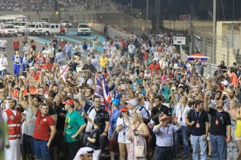 World © Octane Photographic Ltd. Sunday 23rd November 2014. Abu Dhabi Grand Prix - Yas Marina Circuit - Formula 1 Podium. Mercedes AMG Petronas – Fans on the track. Digital Ref: 1173CB1D0903
