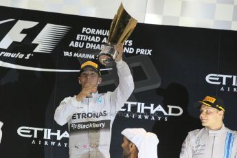 World © Octane Photographic Ltd. Sunday 23rd November 2014. Abu Dhabi Grand Prix - Yas Marina Circuit - Formula 1 Podium. Mercedes AMG Petronas – Lewis Hamilton - Race winner and 2014 World Champion. Digital Ref: 1173CB1D0960