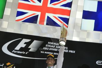 World © Octane Photographic Ltd. Sunday 23rd November 2014. Abu Dhabi Grand Prix - Yas Marina Circuit - Formula 1 Podium. Mercedes AMG Petronas – Lewis Hamilton - Race winner and 2014 World Champion. Digital Ref: 1173CB1D0961