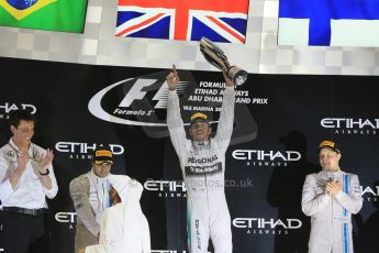 World © Octane Photographic Ltd. Sunday 23rd November 2014. Abu Dhabi Grand Prix - Yas Marina Circuit - Formula 1 Podium. Mercedes AMG Petronas – Lewis Hamilton - Race winner and 2014 World Champion and Williams Racing - Felipe Massa (2nd) and Valtteri Bottas (3rd). Digital Ref: 1173CB1D0973