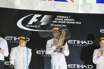 World © Octane Photographic Ltd. Sunday 23rd November 2014. Abu Dhabi Grand Prix - Yas Marina Circuit - Formula 1 Podium. Mercedes AMG Petronas – Lewis Hamilton - Race winner and 2014 World Champion and Williams Racing - Felipe Massa (2nd) and Valtteri Bottas (3rd). Digital Ref: 1173CB1D0997
