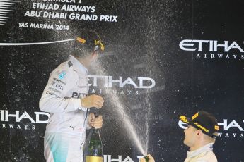 World © Octane Photographic Ltd. Sunday 23rd November 2014. Abu Dhabi Grand Prix - Yas Marina Circuit - Formula 1 Podium. Mercedes AMG Petronas – Lewis Hamilton - Race winner and 2014 World Champion. Digital Ref: 1173CB1D1140
