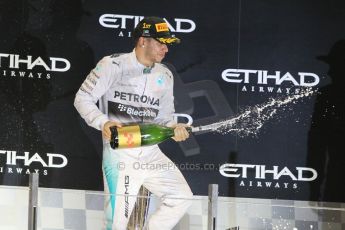 World © Octane Photographic Ltd. Sunday 23rd November 2014. Abu Dhabi Grand Prix - Yas Marina Circuit - Formula 1 Podium. Mercedes AMG Petronas – Lewis Hamilton - Race winner and 2014 World Champion. Digital Ref: 1173CB1D1174