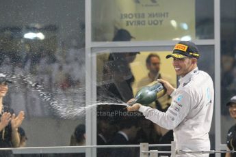 World © Octane Photographic Ltd. Sunday 23rd November 2014. Abu Dhabi Grand Prix - Yas Marina Circuit - Formula 1 Podium. Mercedes AMG Petronas – Lewis Hamilton - Race winner and 2014 World Champion. Digital Ref: 1173CB1D1212