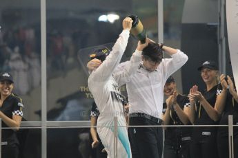 World © Octane Photographic Ltd. Sunday 23rd November 2014. Abu Dhabi Grand Prix - Yas Marina Circuit - Formula 1 Podium. Mercedes AMG Petronas – Lewis Hamilton - Race winner and 2014 World Champion and Williams Racing - Felipe Massa (2nd) and Valtteri Bottas (3rd). Digital Ref: 1173CB1D1261