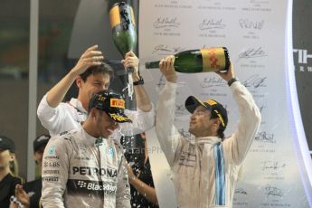 World © Octane Photographic Ltd. Sunday 23rd November 2014. Abu Dhabi Grand Prix - Yas Marina Circuit - Formula 1 Podium. Mercedes AMG Petronas – Lewis Hamilton - Race winner and 2014 World Champion and Williams Racing - Felipe Massa (2nd) and Valtteri Bottas (3rd). Digital Ref: 1173CB1D1288