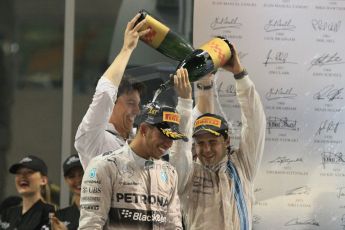 World © Octane Photographic Ltd. Sunday 23rd November 2014. Abu Dhabi Grand Prix - Yas Marina Circuit - Formula 1 Podium. Mercedes AMG Petronas – Lewis Hamilton - Race winner and 2014 World Champion and Williams Racing - Felipe Massa (2nd) and Valtteri Bottas (3rd). Digital Ref: 1173CB1D1297