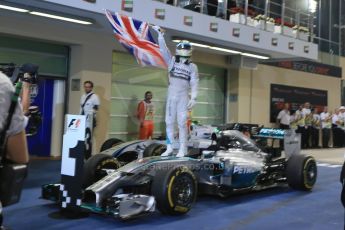 World © Octane Photographic Ltd. Sunday 23rd November 2014. Abu Dhabi Grand Prix - Yas Marina Circuit - Formula 1 Podium. Mercedes AMG Petronas – Lewis Hamilton - Race winner and 2014 World Champion. Digital Ref: 1173LB1D7622