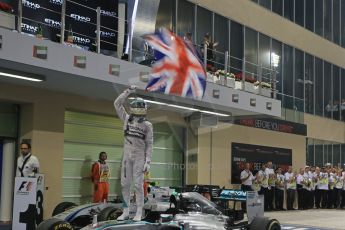 World © Octane Photographic Ltd. Sunday 23rd November 2014. Abu Dhabi Grand Prix - Yas Marina Circuit - Formula 1 Podium. Mercedes AMG Petronas – Lewis Hamilton - Race winner and 2014 World Champion. Digital Ref: 1173LB1D7624