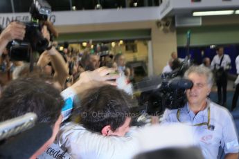 World © Octane Photographic Ltd. Sunday 23rd November 2014. Abu Dhabi Grand Prix - Yas Marina Circuit - Formula 1 Podium. Mercedes AMG Petronas – Lewis Hamilton - Race winner and 2014 World Champion greeting his team and family. Digital Ref: 1173LB1D7694