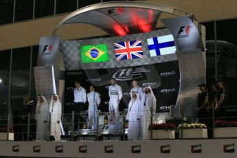 World © Octane Photographic Ltd. Sunday 23rd November 2014. Abu Dhabi Grand Prix - Yas Marina Circuit - Formula 1 Podium. Mercedes AMG Petronas – Lewis Hamilton - Race winner and 2014 World Champion and Williams Racing - Felipe Massa (2nd) and Valtteri Bottas (3rd). Digital Ref: 1173LB1DX7527